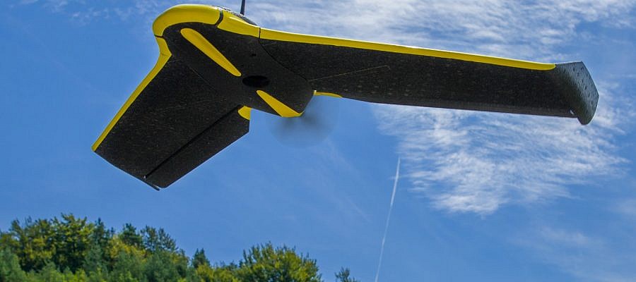 How can a lightweight unmanned aircraft be stable enough to capture high resolution aerial photos?