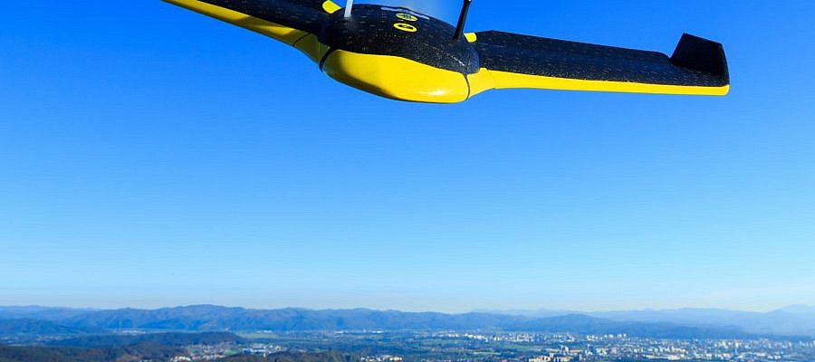 At what altitudes can the senseFly eBees unmanned aircraft fly?